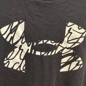 Under Armour xs womans  black t-shirt material with white and black logo